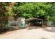 Spacious carport and shed with ample parking, nestled amidst lush greenery at 674 Crespan Ct, Lawrenceville, GA 30044