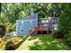 Charming blue two-story home with landscaped yard and cozy porch at 674 Crespan Ct, Lawrenceville, GA 30044