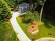 Charming two-story home with a long driveway and lush, green landscaping at 674 Crespan Ct, Lawrenceville, GA 30044