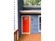 Vibrant red front door with a decorative window panel and modern hardware at 674 Crespan Ct, Lawrenceville, GA 30044