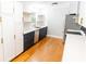 Bright kitchen with white cabinets, floating shelves, and stainless steel appliances at 674 Crespan Ct, Lawrenceville, GA 30044