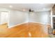 Open living room with hardwood floors, stone fireplace, and ample space at 674 Crespan Ct, Lawrenceville, GA 30044