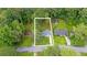 Aerial view of the property surrounded by mature trees, showcasing the lot lines at 2720 Cavalier Dr, Decatur, GA 30034