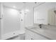 Modern bathroom features white subway tile, a shower, and a vanity with quartz countertops at 2720 Cavalier Dr, Decatur, GA 30034