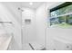 Bright bathroom features a walk-in shower and a window at 2720 Cavalier Dr, Decatur, GA 30034