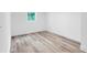 This bedroom features light-tone wood flooring and a window at 2720 Cavalier Dr, Decatur, GA 30034