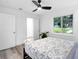 Bedroom features light wood floors, a ceiling fan, and bright light at 2720 Cavalier Dr, Decatur, GA 30034