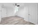 Bright, modern bedroom with ceiling fan, light gray flooring, and white trim at 2720 Cavalier Dr, Decatur, GA 30034
