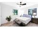 Cozy bedroom features light wood floors, windows, and tasteful decor at 2720 Cavalier Dr, Decatur, GA 30034