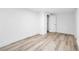 This bedroom features light-tone wood flooring and a walk-in closet at 2720 Cavalier Dr, Decatur, GA 30034