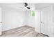 A bright basement bedroom with a fan, window, and a closet at 2720 Cavalier Dr, Decatur, GA 30034