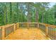A wooden deck with black metal railing offers a nice space for relaxation at 2720 Cavalier Dr, Decatur, GA 30034
