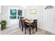 Cozy dining area with modern light fixture and sliding doors to the outdoor deck at 2720 Cavalier Dr, Decatur, GA 30034