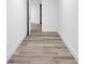 Hallway with updated flooring, leading to closet at 2720 Cavalier Dr, Decatur, GA 30034