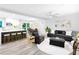 Bright, open living space with modern furniture, connecting kitchen, and dining area at 2720 Cavalier Dr, Decatur, GA 30034