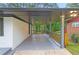 Large covered back porch with painted railings, providing ample outdoor space at 2720 Cavalier Dr, Decatur, GA 30034