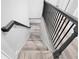 Staircase featuring wood steps and a black metal railing at 2720 Cavalier Dr, Decatur, GA 30034