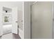 Bathroom showcases a glass-enclosed shower and a door leading to a bedroom with large windows at 359 Azalea Cir, Cumming, GA 30028