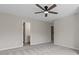 Comfortable bedroom featuring a ceiling fan and adjoining bathroom at 359 Azalea Cir, Cumming, GA 30028