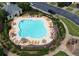 Aerial view of neighborhood pool with lounge chairs and umbrellas at 359 Azalea Cir, Cumming, GA 30028