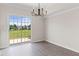 Bright dining room with a sliding glass door offering views of the backyard at 359 Azalea Cir, Cumming, GA 30028