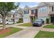 Well-maintained townhouse complex with neat lawns, paved driveways, and a welcoming curb appeal at 359 Azalea Cir, Cumming, GA 30028