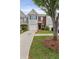 Charming townhouse with a brick facade, a one-car garage, and a well-manicured lawn and landscaping at 359 Azalea Cir, Cumming, GA 30028