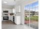 Bright kitchen featuring stainless appliances and a sliding glass door leading to a patio at 359 Azalea Cir, Cumming, GA 30028