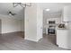 Open-concept kitchen with stainless steel appliances adjacent to living area at 359 Azalea Cir, Cumming, GA 30028