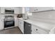 Beautiful kitchen with stainless steel appliances, white cabinets, and elegant countertops at 359 Azalea Cir, Cumming, GA 30028