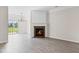 Elegant living room featuring hardwood floors, a fireplace, and sliding glass doors for ample natural light at 359 Azalea Cir, Cumming, GA 30028