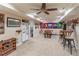 Open basement with a kitchenette, wine rack, foosball table, and ample space for various activities at 366 Coopers Pond Dr, Lawrenceville, GA 30044
