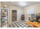 Basement room featuring a work space, office, and media room with a TV and entertainment options at 366 Coopers Pond Dr, Lawrenceville, GA 30044