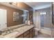 Bathroom featuring granite counters and combination tub and shower at 366 Coopers Pond Dr, Lawrenceville, GA 30044