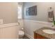Stylish half bath with granite vanity, updated fixtures, and beadboard detail adds a touch of elegance at 366 Coopers Pond Dr, Lawrenceville, GA 30044