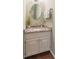 Stylish bathroom with granite countertop and a decorative mirror, providing a touch of elegance at 366 Coopers Pond Dr, Lawrenceville, GA 30044