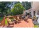 Spacious wooden deck with comfortable seating and a peaceful view of the backyard at 366 Coopers Pond Dr, Lawrenceville, GA 30044