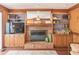 Gathering room fireplace framed by custom cabinets and shelves at 366 Coopers Pond Dr, Lawrenceville, GA 30044