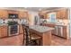 Modern kitchen with granite countertops, stainless appliances, and an island with seating, ideal for cooking and entertaining at 366 Coopers Pond Dr, Lawrenceville, GA 30044
