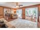 Open living space connects seamlessly to a sunroom and kitchen, creating a great flow for entertaining at 366 Coopers Pond Dr, Lawrenceville, GA 30044