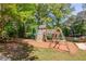 Community playground with climbing structures, slides, and picnic area at 366 Coopers Pond Dr, Lawrenceville, GA 30044