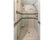 Modern shower with tile surround, glass door, and dual shower heads at 366 Coopers Pond Dr, Lawrenceville, GA 30044