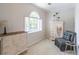 Cozy sitting area with natural light from the window at 366 Coopers Pond Dr, Lawrenceville, GA 30044