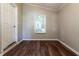 Bedroom featuring new hardwood floors and lots of natural light and access to outside at 3993 Forrest Ct, Atlanta, GA 30341