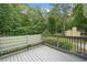 Exterior view of a deck with built-in seating, overlooking a beautiful backyard at 5045 Shadow Wood Dr, Canton, GA 30114