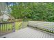 Lovely deck with built-in seating, overlooking a private, wooded backyard at 5045 Shadow Wood Dr, Canton, GA 30114
