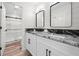 Bright bathroom featuring double sinks, granite countertops, and modern fixtures at 5045 Shadow Wood Dr, Canton, GA 30114