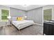 Bright bedroom featuring neutral colors, modern trim, and hardwood flooring at 5045 Shadow Wood Dr, Canton, GA 30114