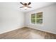 Bedroom with large window offering a lovely view, and a ceiling fan at 5045 Shadow Wood Dr, Canton, GA 30114