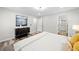 Bright bedroom with gray flooring, modern decor, and ensuite bath at 5045 Shadow Wood Dr, Canton, GA 30114